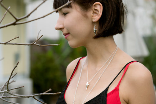 great white earring + necklace on model
